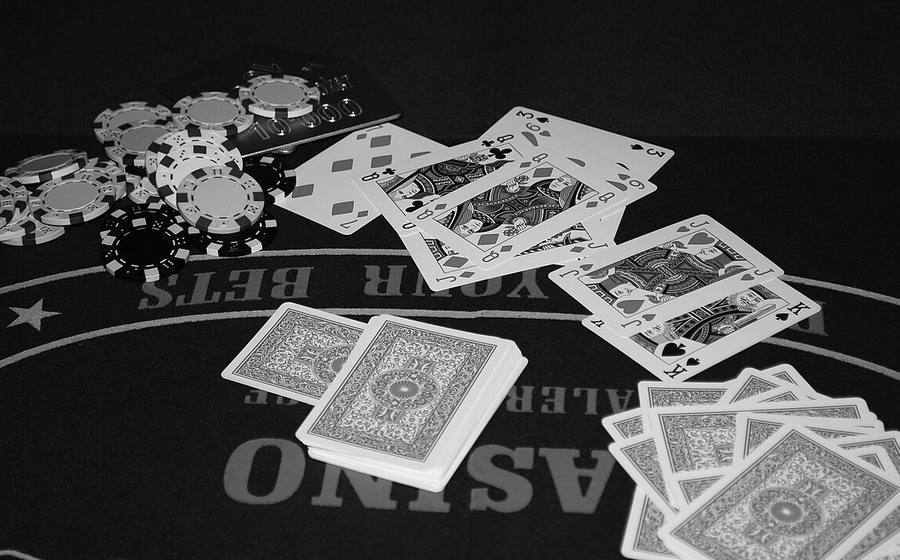 Cards and chips on a casino poker table felt (representative photo)
